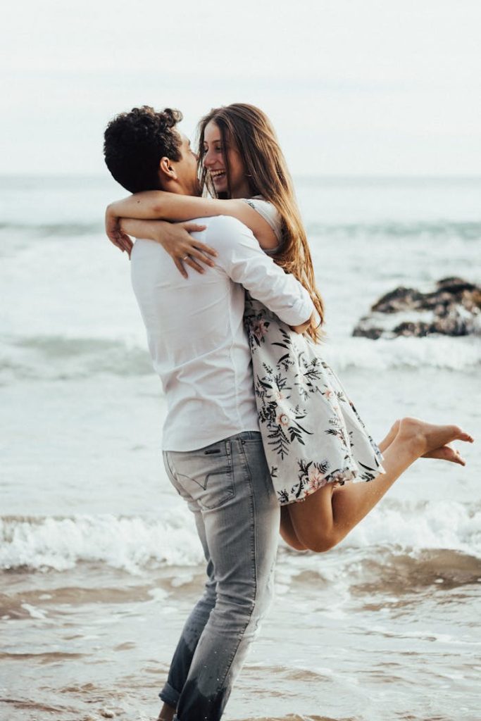 pexels-photo-2808658 Photo of a Man Lifting Woman Near Body of Water