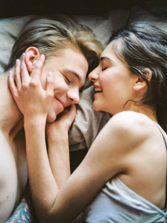 pexels-photo-414032 Man and Woman Lying on Bed